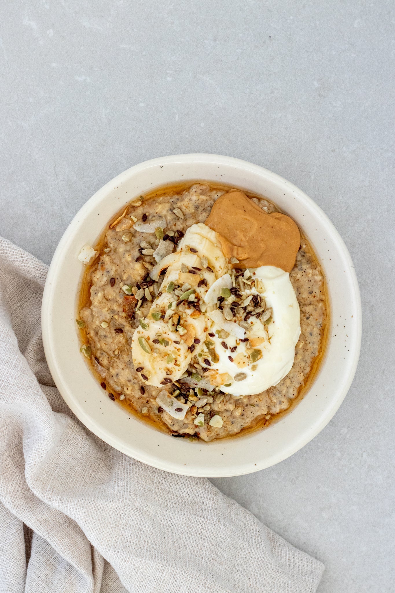 Creamy Vanilla Protein Oats with Peanut Butter and Banana